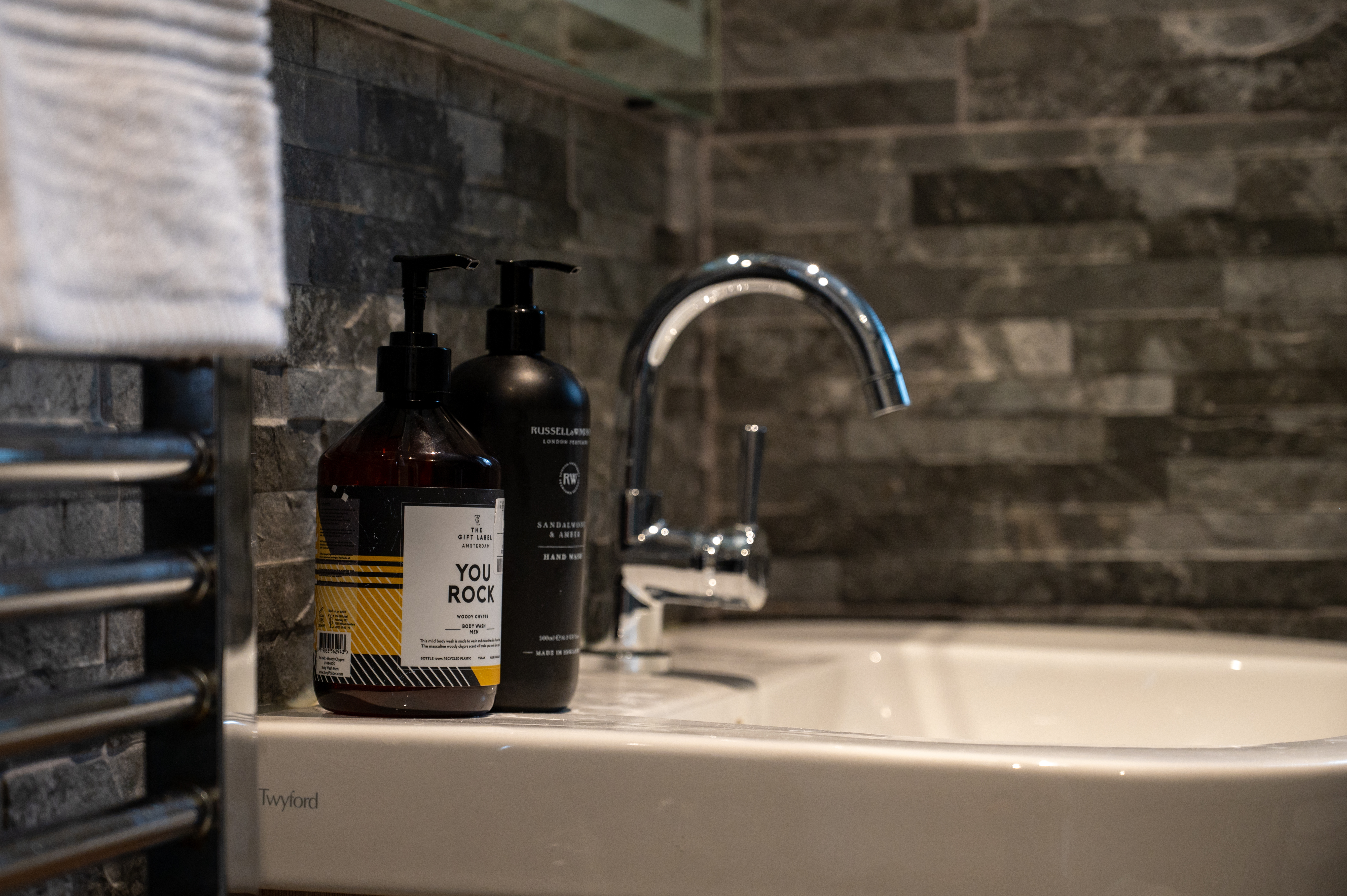 Shower room with luxury toiletries and slate tiles